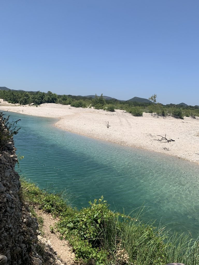 Gorgeous blue waters and rugged terrain along the Nueces River—scenery you can enjoy when staying at Nueces River RV & Cabin Resort. Credit: u/baddies_n_nightgowns via r/texas