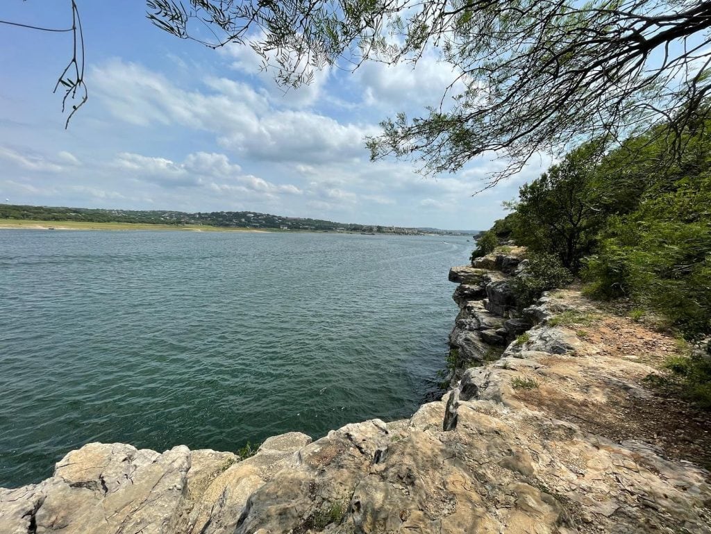 The swimming area at Pace Bend Park offers clear water, scenic cliffs, and plenty of spots where you can jump in if you’re feeling brave. Credit: @blobiel via Instagram