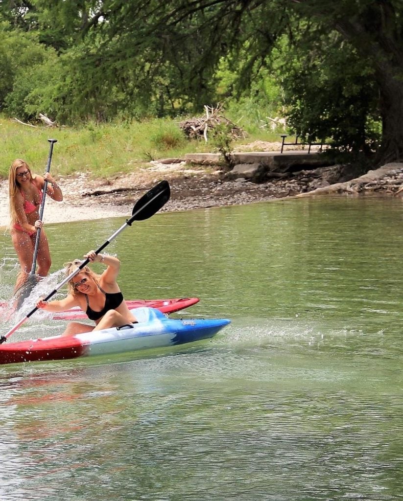 Guests at Rio Bella Resort kayaking on the Frio River—easy, direct river access makes it effortless to get out on the water. Credit: @riobellaresort via Instagram