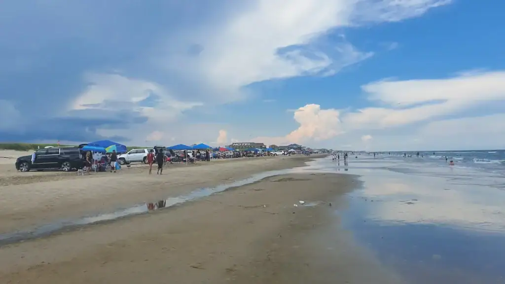 A wide stretch of Surfside’s beach lets you park right on the sand and dive straight into seaside fun. Credit: Sebastian Gawin