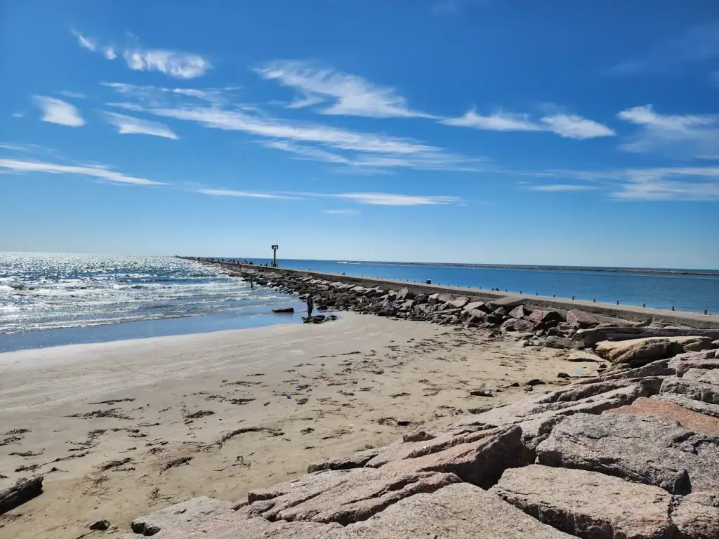 A stunning view of the Gulf at Surfside Beach, complete with a walkway stretching right into the water for an unforgettable coastal experience. Credit: Jennifer Fosnaugh