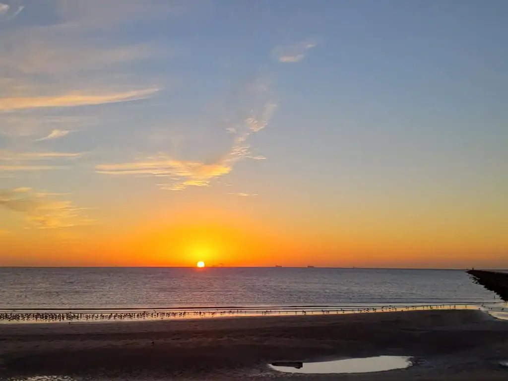 Sunset at Surfside Beach paints the sky with breathtaking colors, the perfect ending to a coastal day. Credit: Basudeb Bhaumik