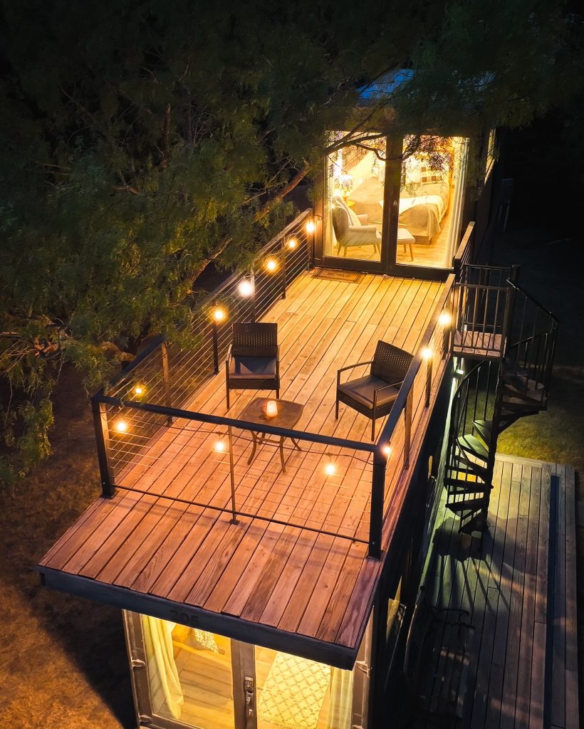 The rooftop deck at night — softly lit and effortlessly vibey. It’s the kind of space where you sit back, breathe in the evening air, and forget about the outside world for a while. Credit: @cargo_home via Instagram