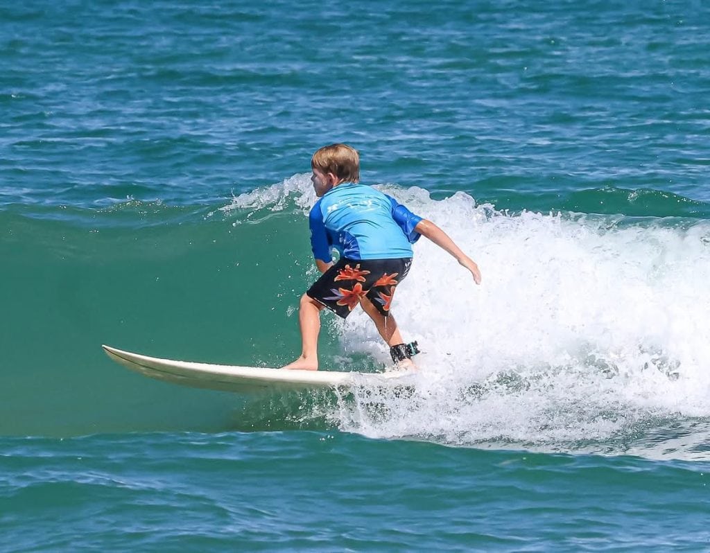 Surfing the waves at South Padre Island—one of Texas’ top spots for catching big waves and coastal adventure. Credit: @txsurfcamp via Instagram