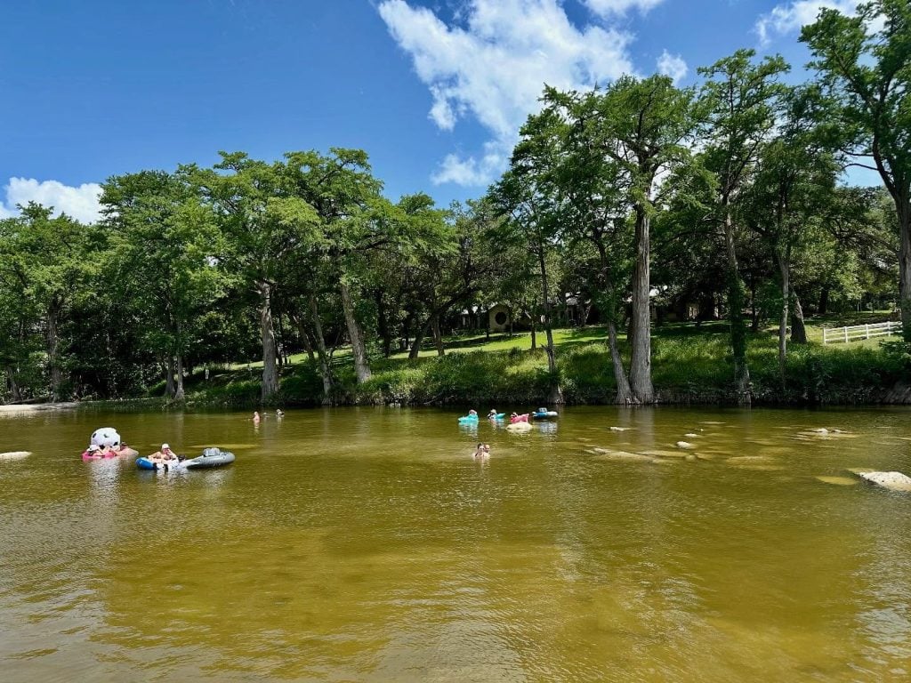 Floating along the Blanco River means calm waters, sunshine, and ultimate relaxation. Credit: @7a_ranch via Instagram