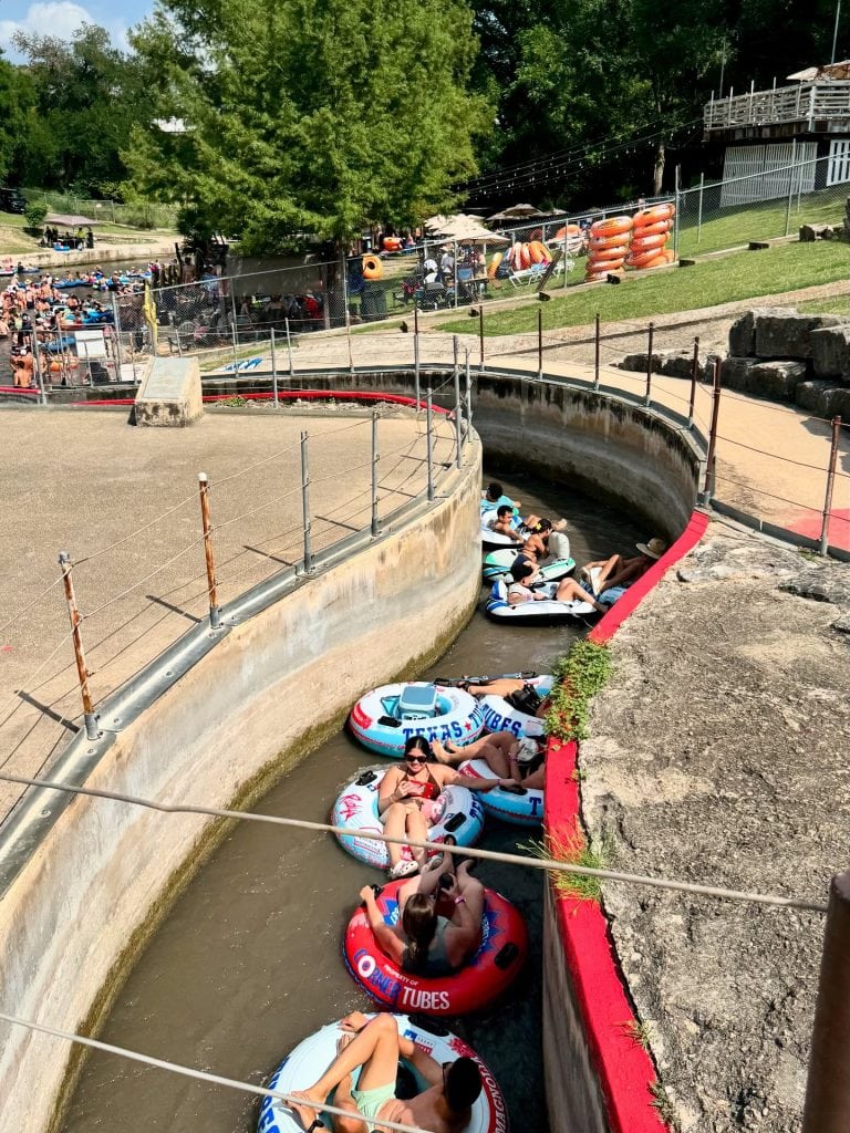Crowds gather at the famous tube chute on the Comal River, where the float turns into a fun, fast-paced splash. Credit: @inandaroundnbtx via Instagram