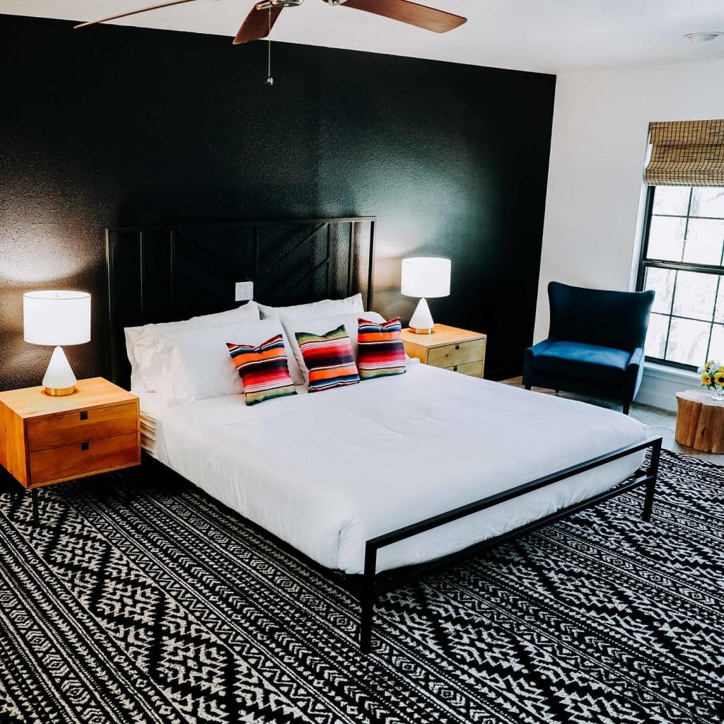 A cozy and sleek room at Wimberley Inn—romantic, peaceful, and paired with beautiful Hill Country hilltop views. Credit: @wimberleyinn via Instagram