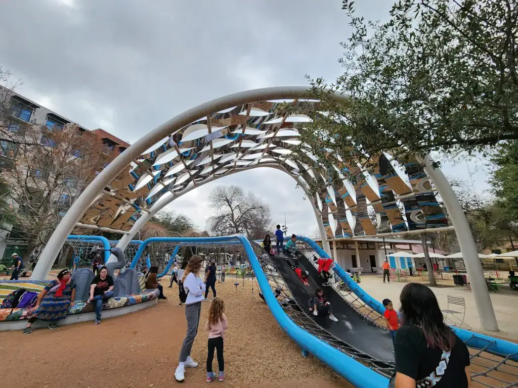 Another angle of the boomerang net play shows kids sliding through its dynamic, netted structure. Credit: Austin Johnson