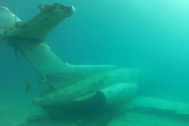One of the sunken planes in the lake awaits scuba divers exploring beneath the surface. Credit: Athens Scuba Park