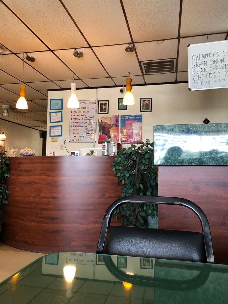 The humble cashier area reflects the restaurant’s simplicity, with some menu items handwritten on whiteboards. Credit: Joe S.