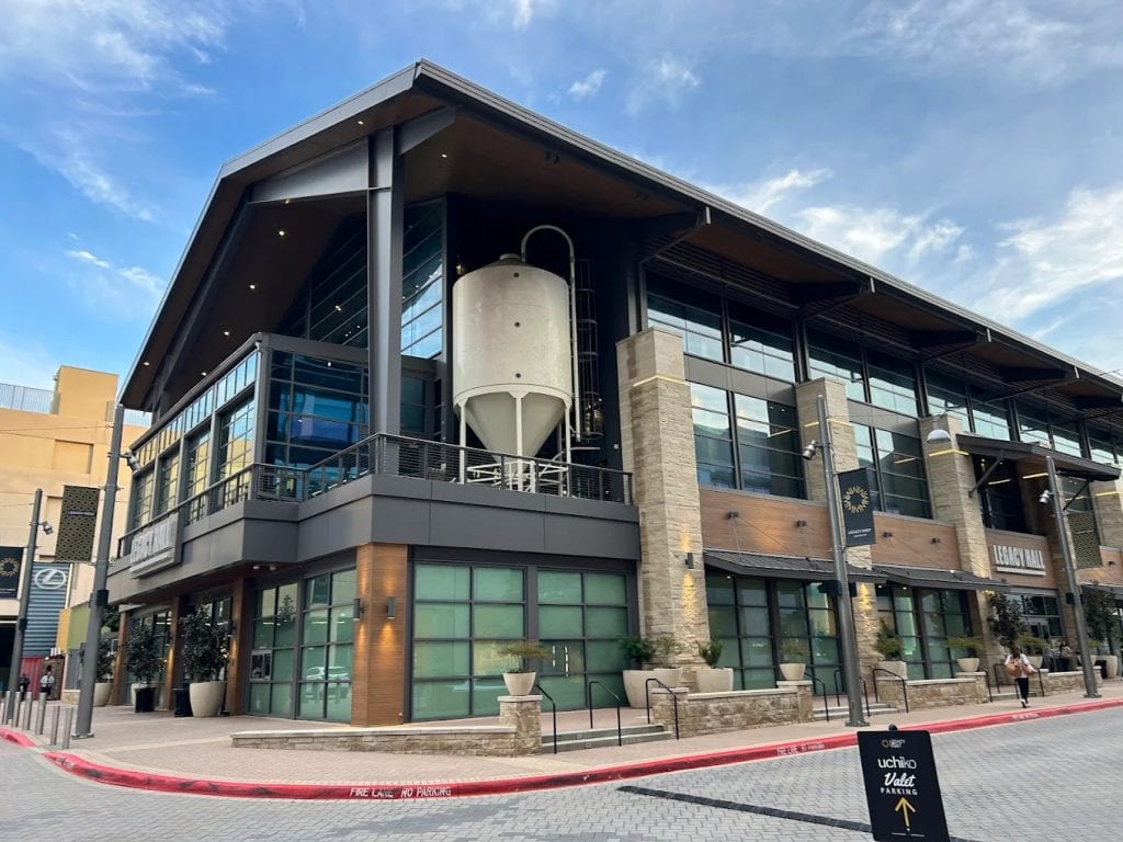 Another view of Legacy Hall shows its massive two‑floor building with plenty of parking space for visitors. Credit: Diogenes Reyes
