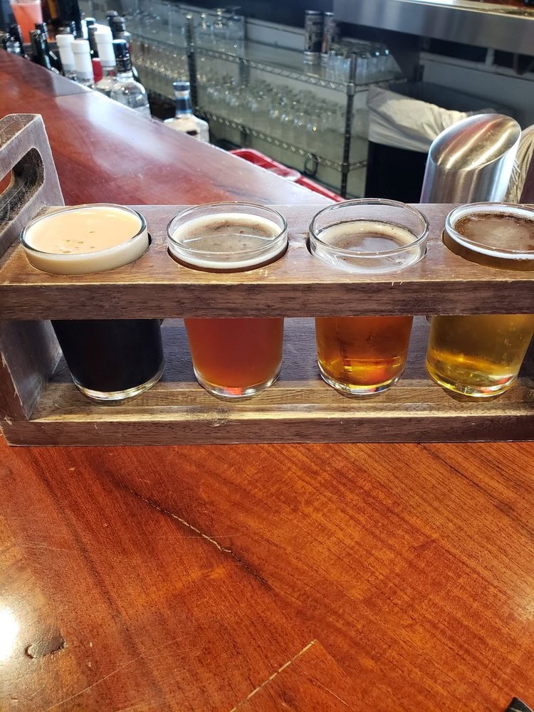 High Bar Taproom offers a beer flight, turning tasting samples into a fun lineup of mini pours. Credit: Christa M.