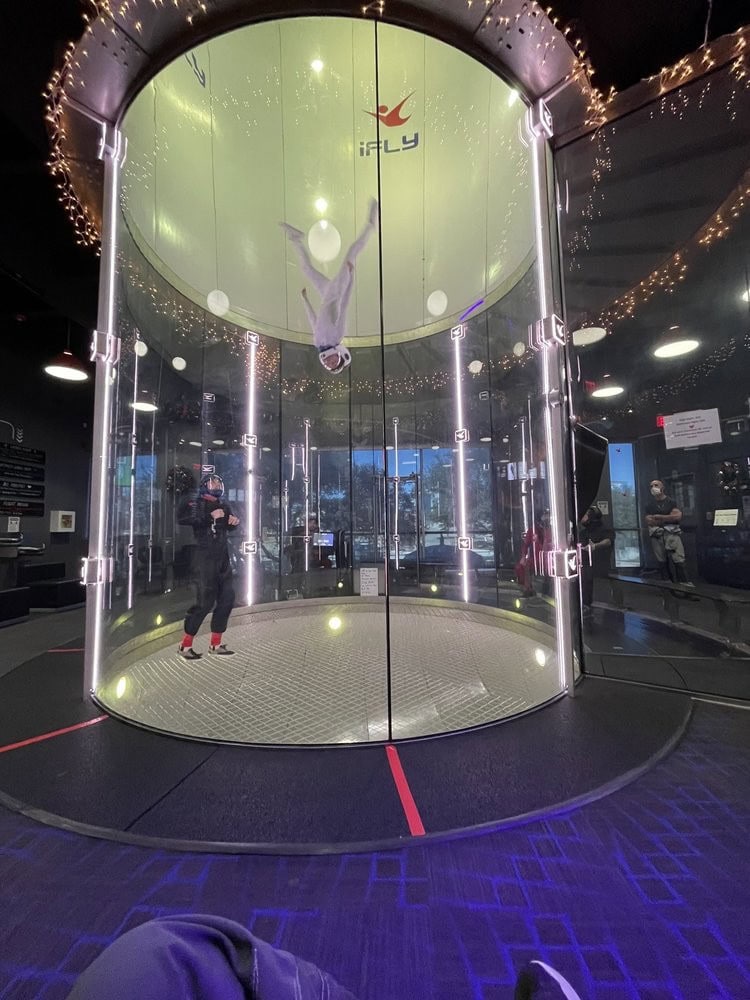 The glass skydiving chamber lets everyone outside watch the excitement unfold inside. Credit: Joel T.