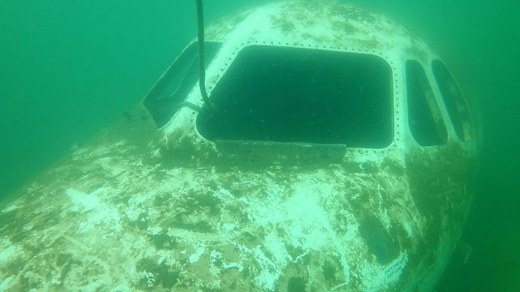 The front of a sunken plane in the lake creates a surreal underwater sight for divers. Credit: Jake “AH0meLEssguy” Harris
