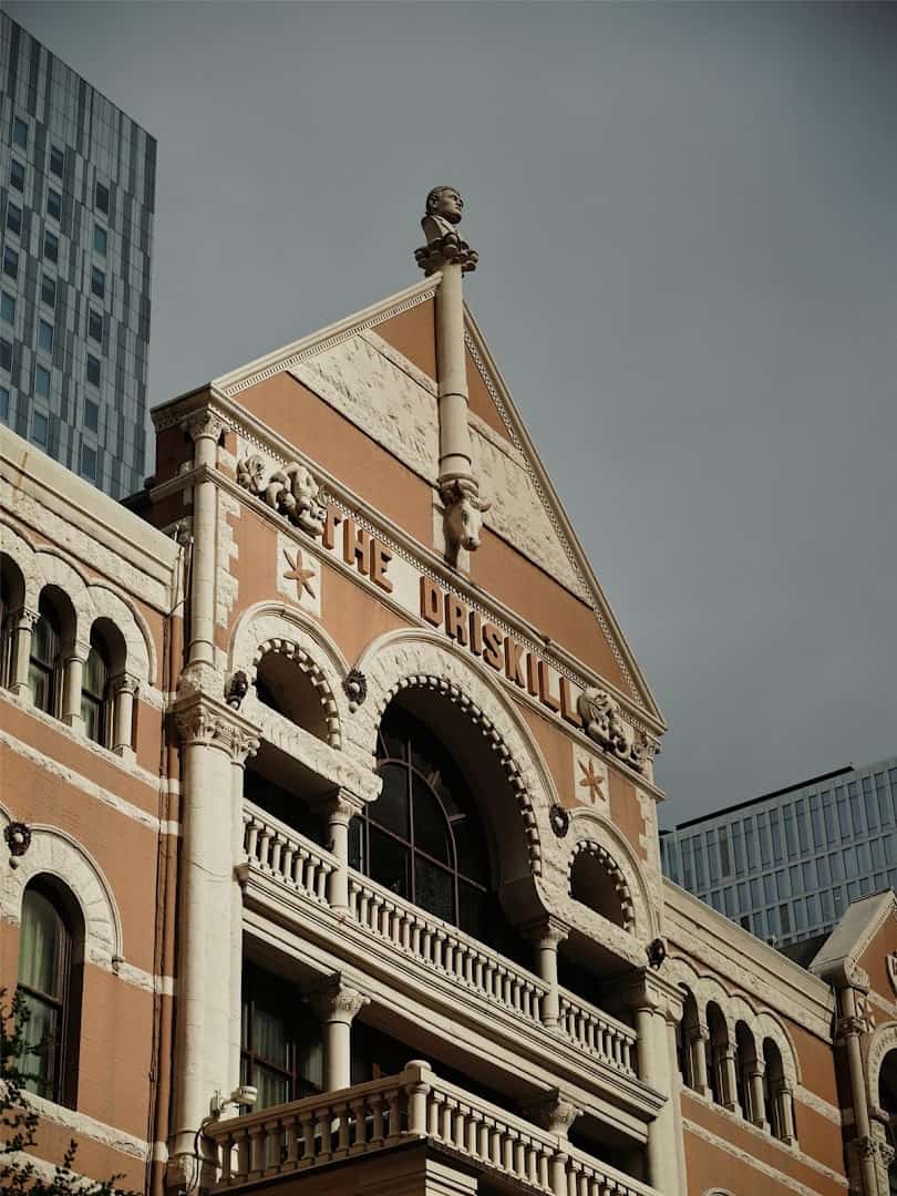 The Romanesque stone facade of The Driskill hotel in Austin, Texas