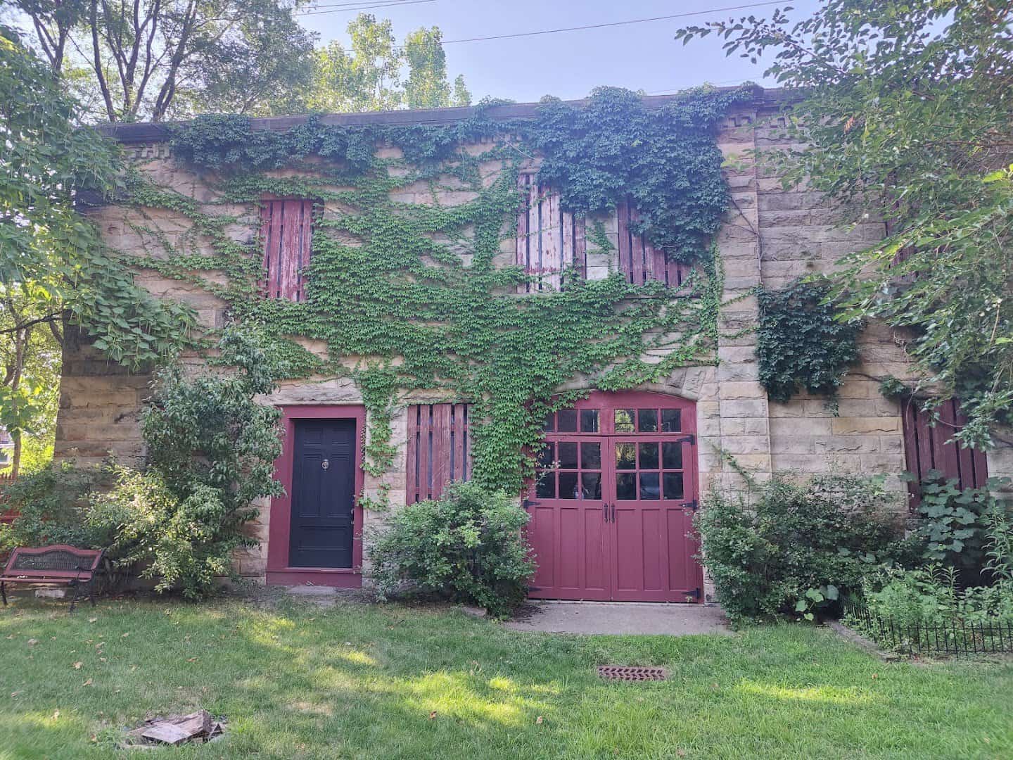 The ivy-covered gothic stone exterior of Franklin Castle in Cleveland, Ohio