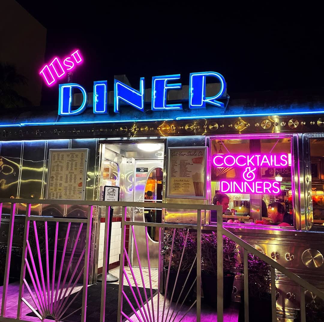 Neon sign and chrome exterior of the 11th Street Diner in Miami Beach, Florida