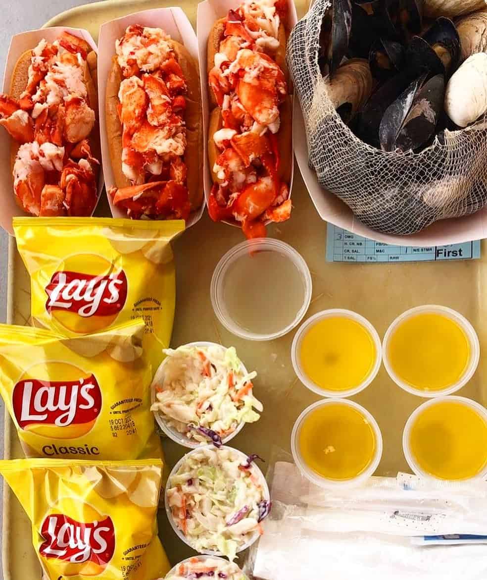 Three hot buttered lobster rolls at Abbott's Lobster in the Rough in Noank, Connecticut