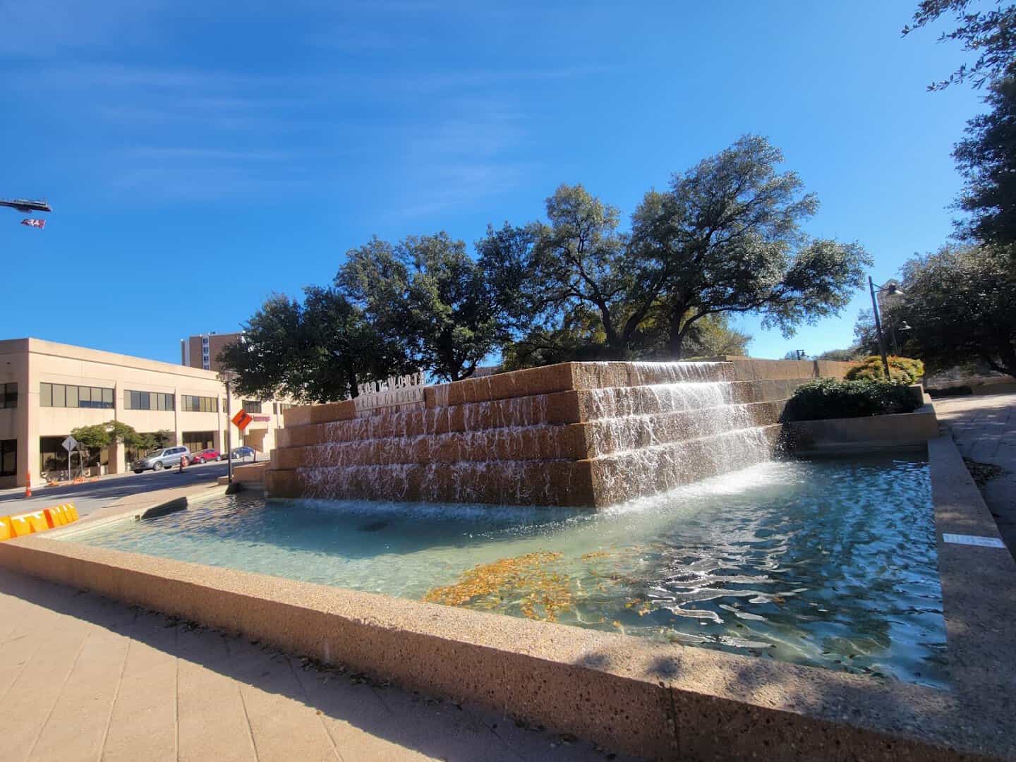 The Active Pool cascade under a blue sky at the Fort Worth Water Gardens