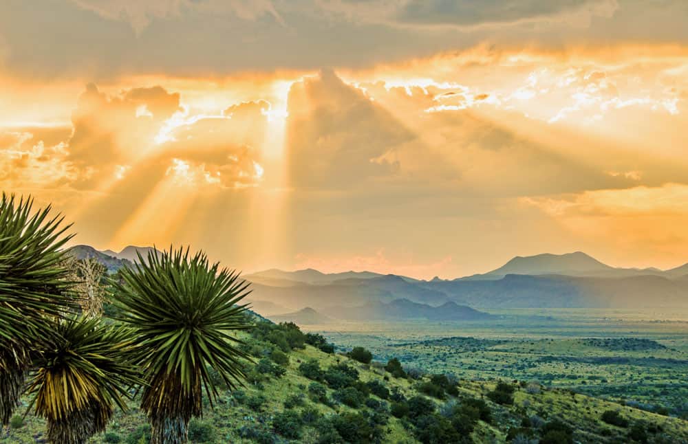 Sun rays over the mountains at sunset near Alpine, Texas