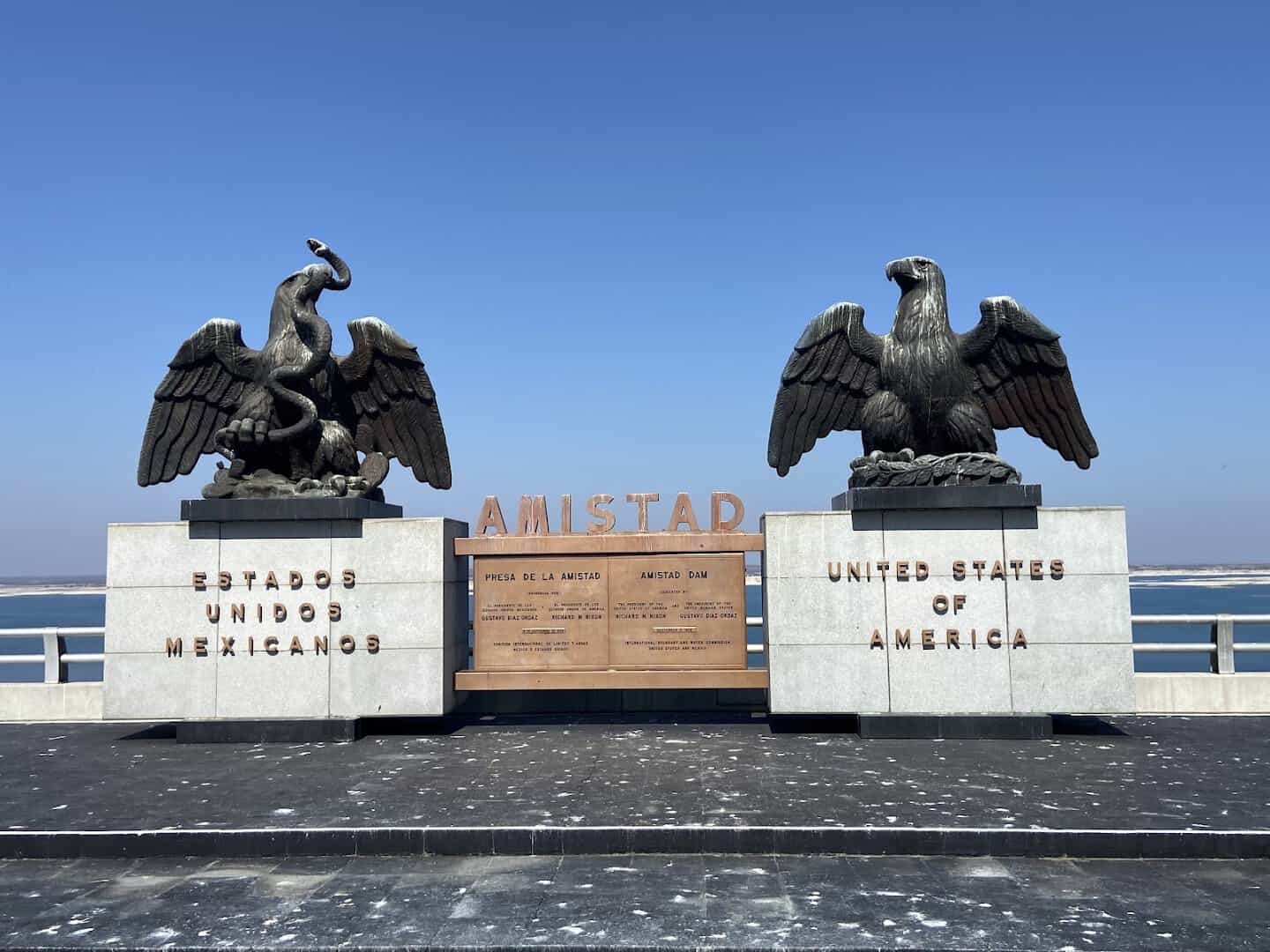 The two bronze eagle monuments marking the U.S. and Mexico sides of Amistad Dam, Texas