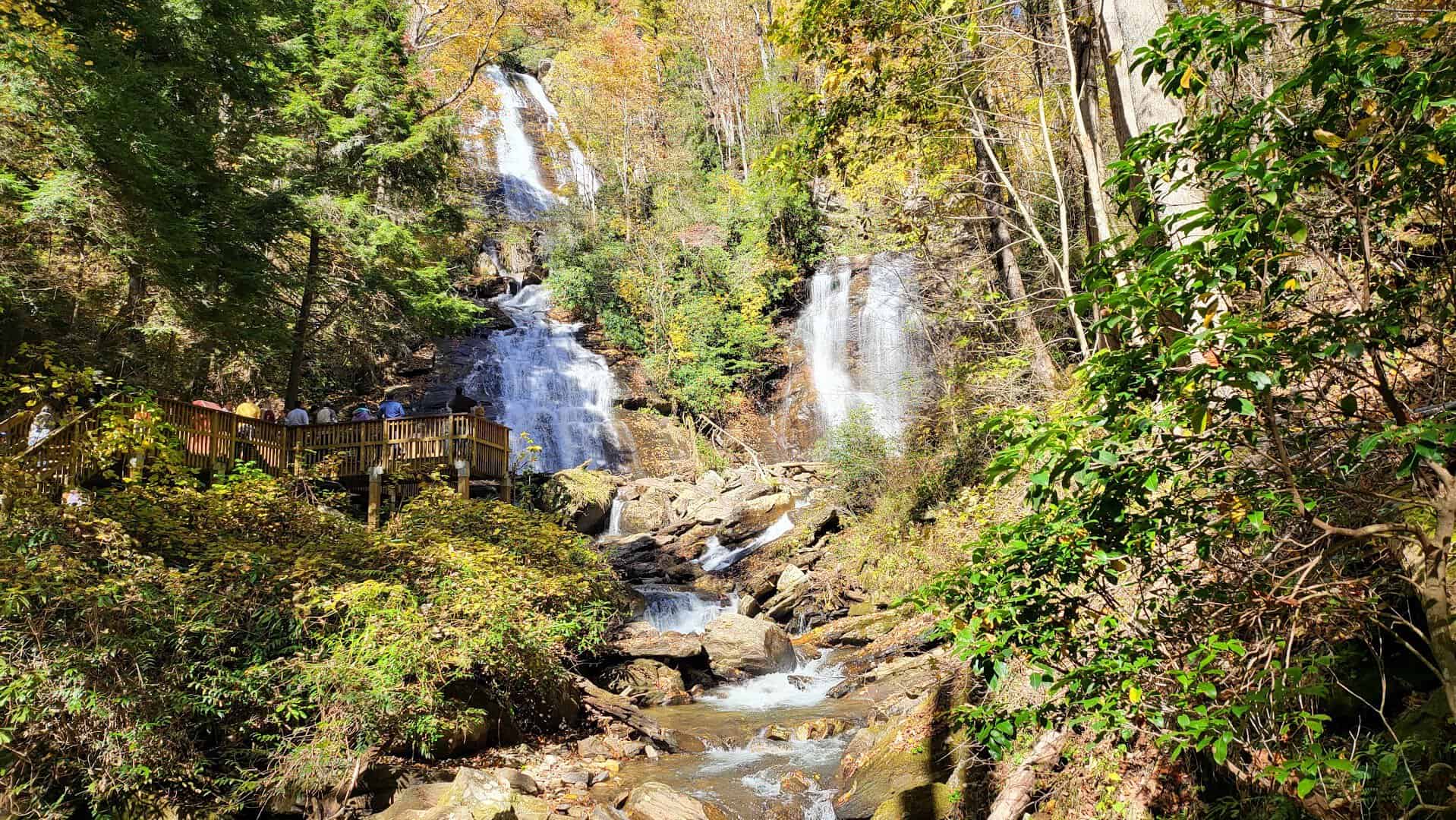 Anna Ruby Falls framed by fall foliage near Helen, Georgia
