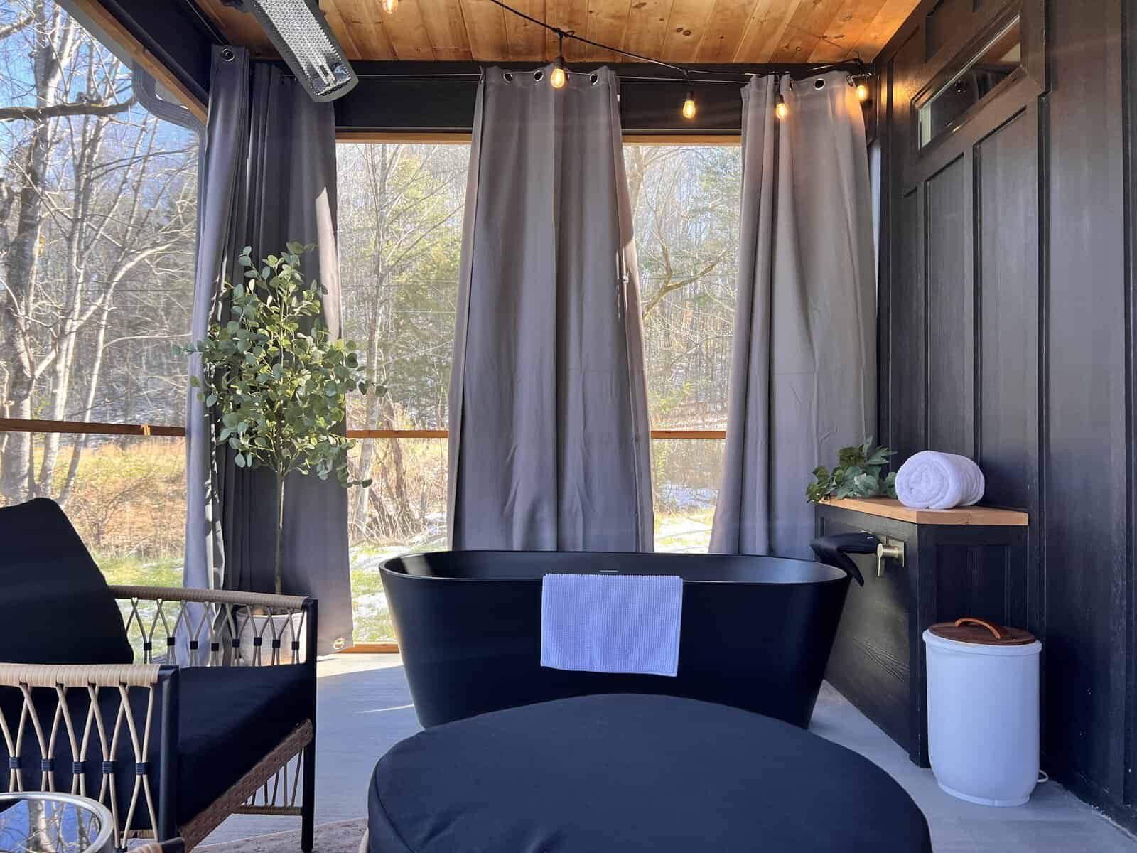 Private screened patio with an outdoor soaking tub at Anson Arbor Farm in Sevierville, Tennessee
