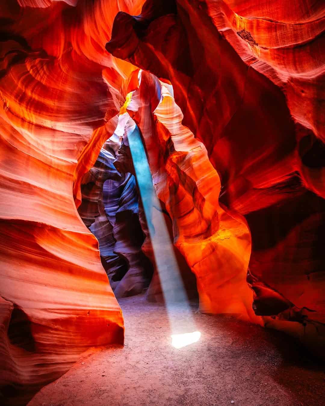 A shaft of sunlight beaming down into the red walls of Upper Antelope Canyon, Arizona