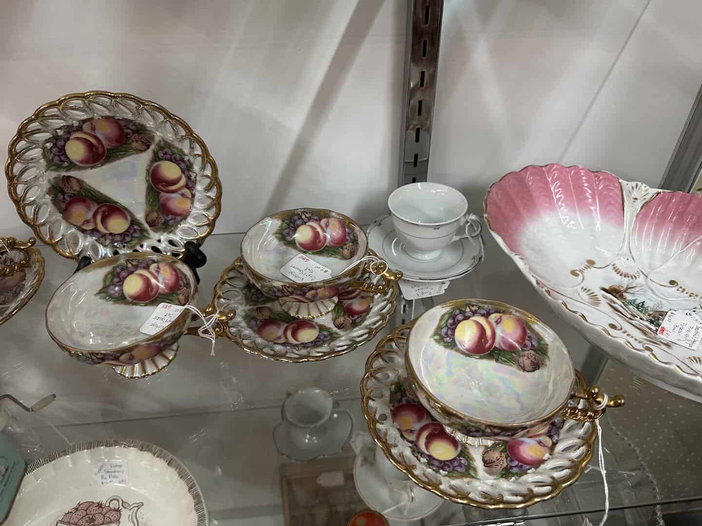 Display of antique fine china plates and cups at a Fort Worth antique mall