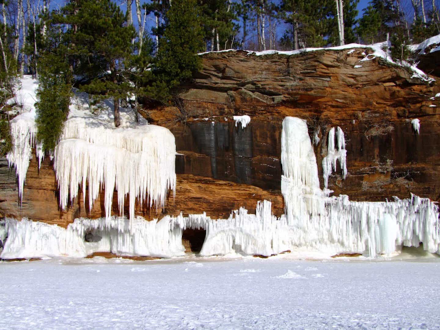 Frozen icicles coating the sandstone sea caves of the Apostle Islands in winter, Wisconsin