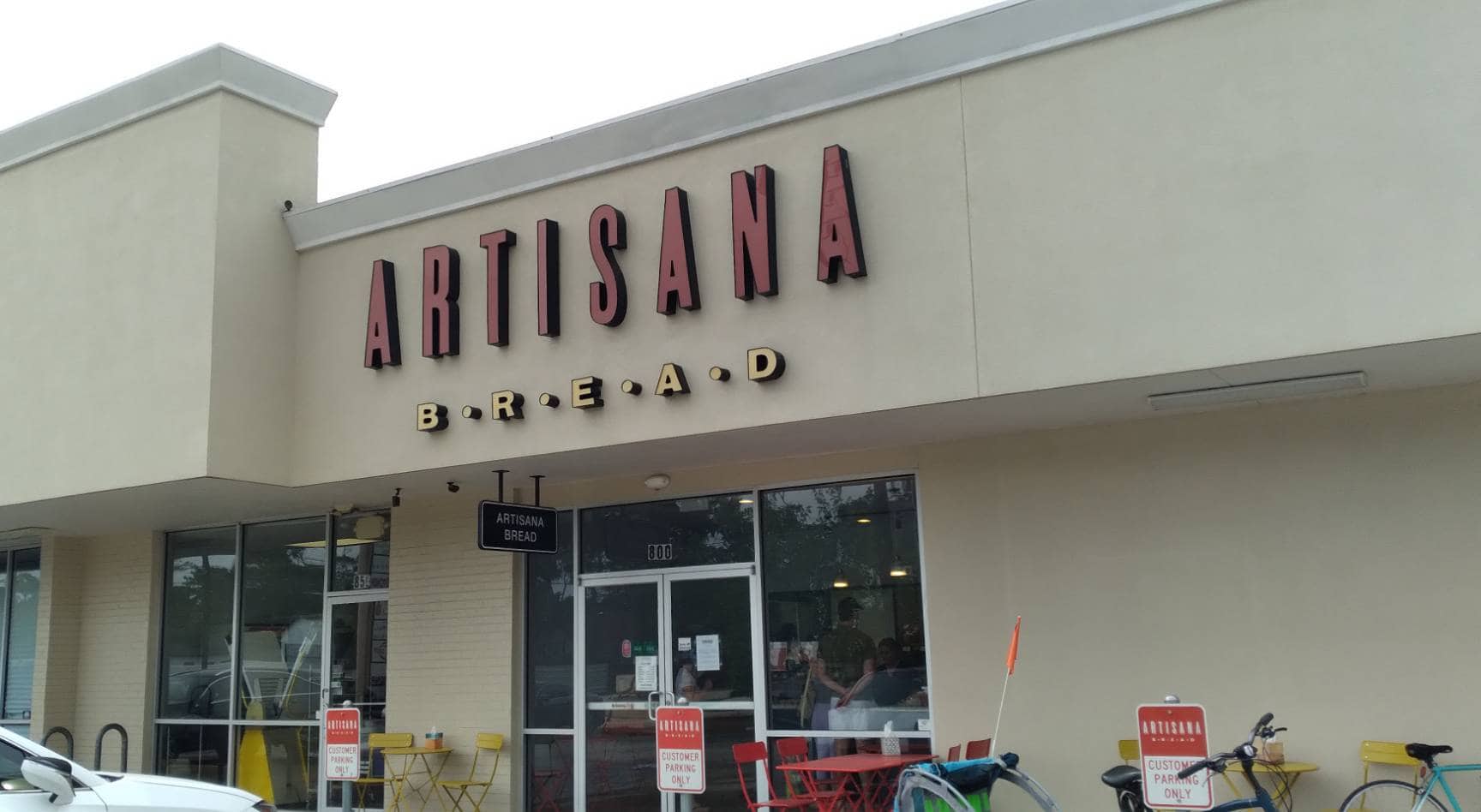The storefront exterior of Artisana Bread in Houston, Texas