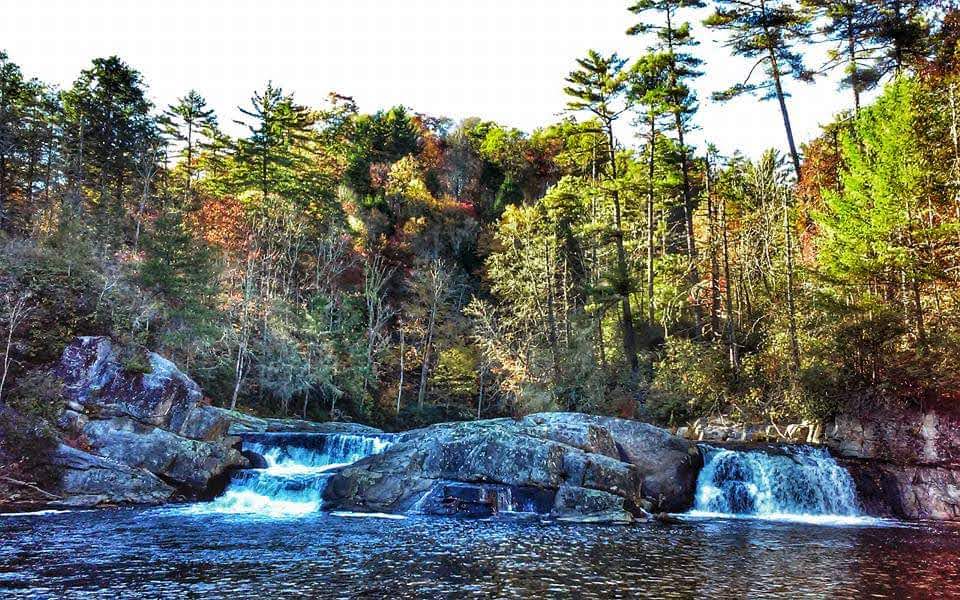 Waterfall surrounded by autumn colored forest near Asheville, North Carolina