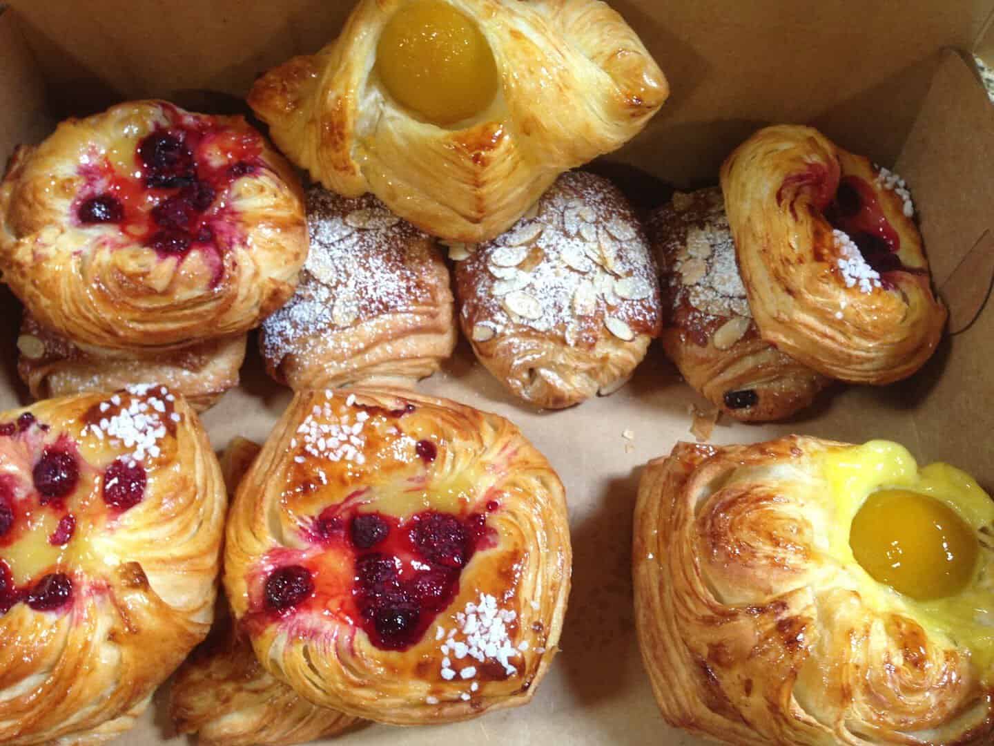 A box of assorted fruit and custard danishes at Artisana Bread in Houston, Texas
