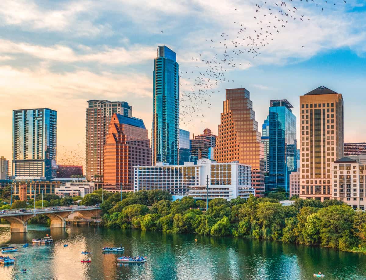 Bats streaming above the downtown Austin skyline over Lady Bird Lake