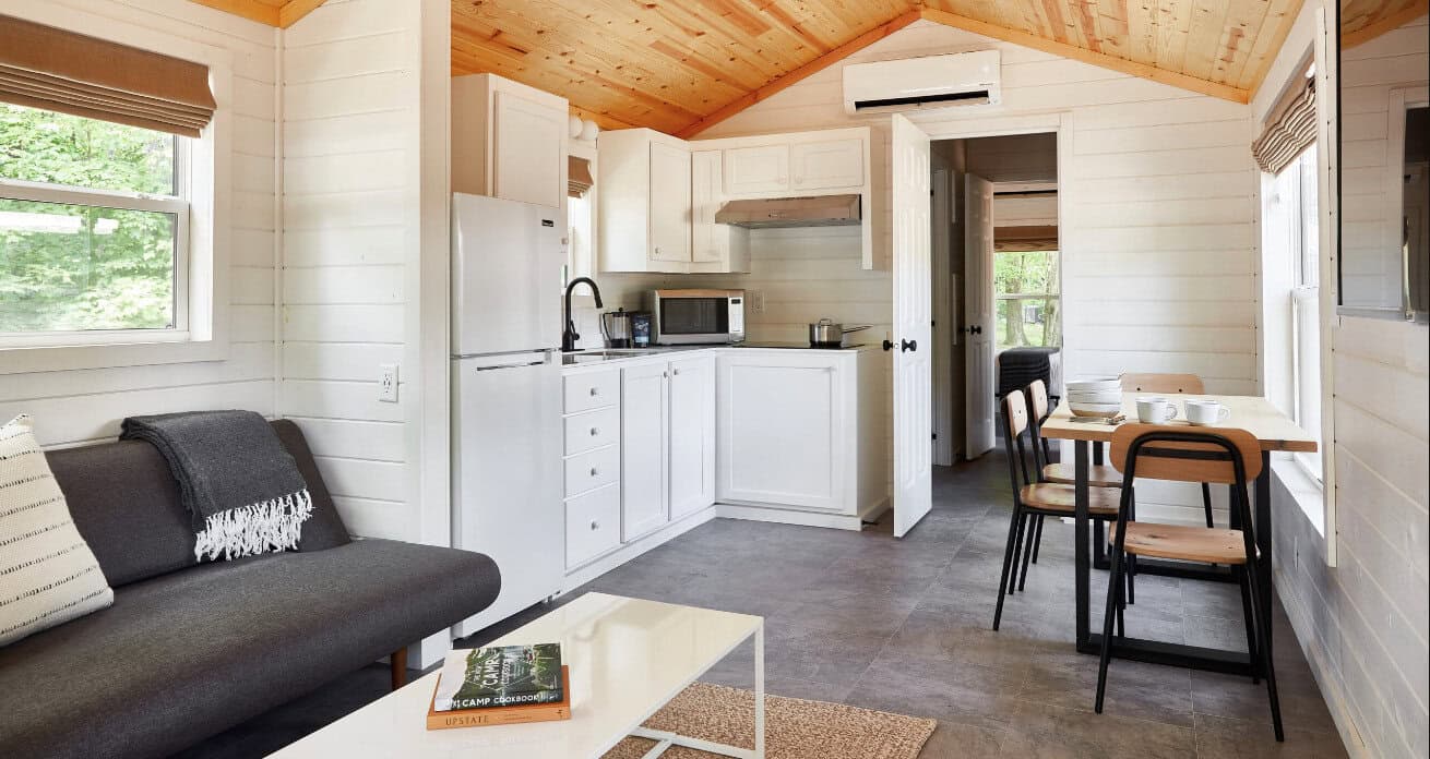Modern cabin interior with a kitchen at AutoCamp Yosemite in California