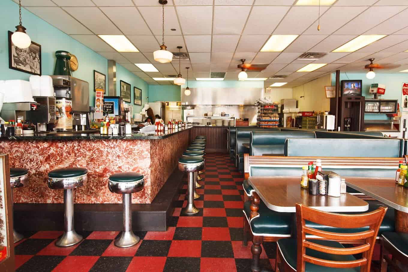 Retro counter and stools inside Avalon Diner in Houston, Texas