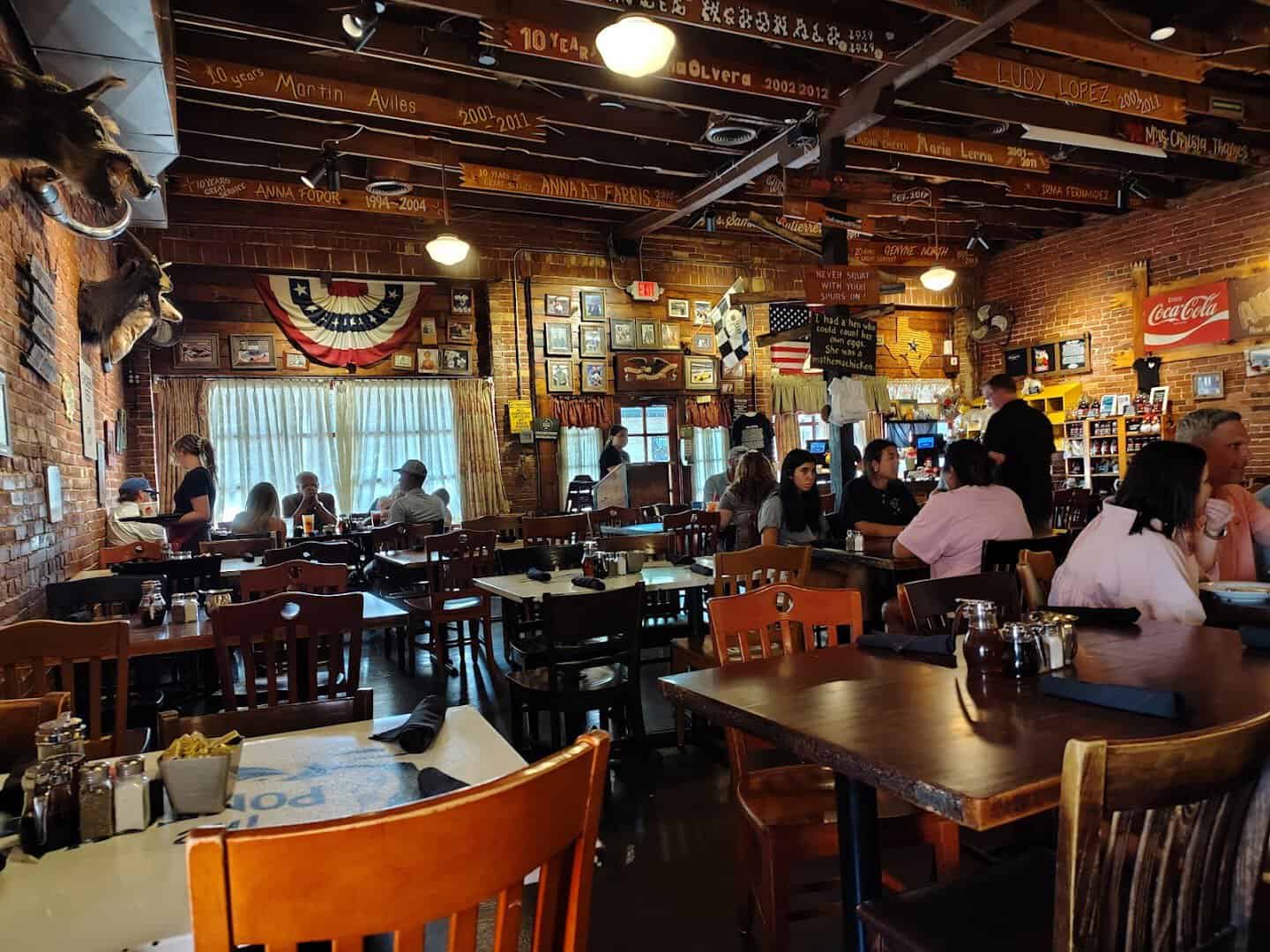 Warm, rustic dining room at Babe's Chicken Dinner House in Roanoke, Texas