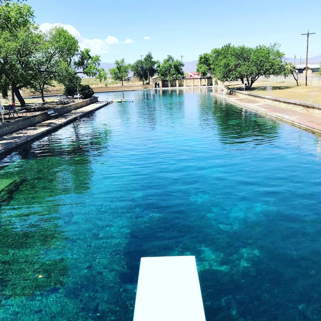 Crystal-clear spring water and a diving board at San Solomon Springs pool, Balmorhea State Park, Texas