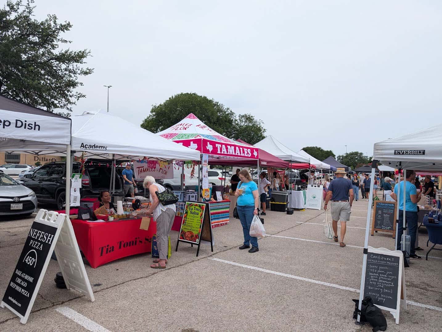 Rows of vendor canopies at Barton Creek Farmers Market in Austin, Texas