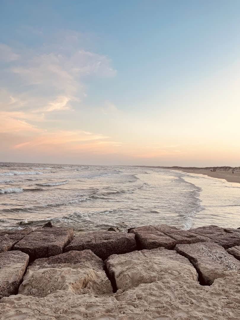 Wide low-tide beach flats at sunset at Mustang Island State Park, Texas