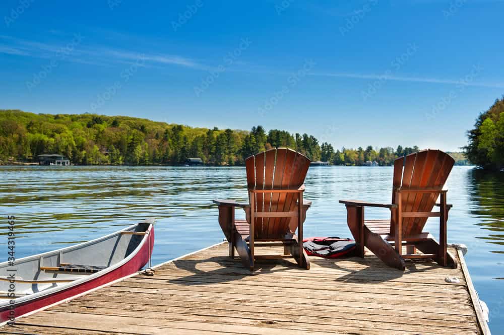 Dock and Adirondack chairs over Norris Lake at Beach Island Resort, Tennessee