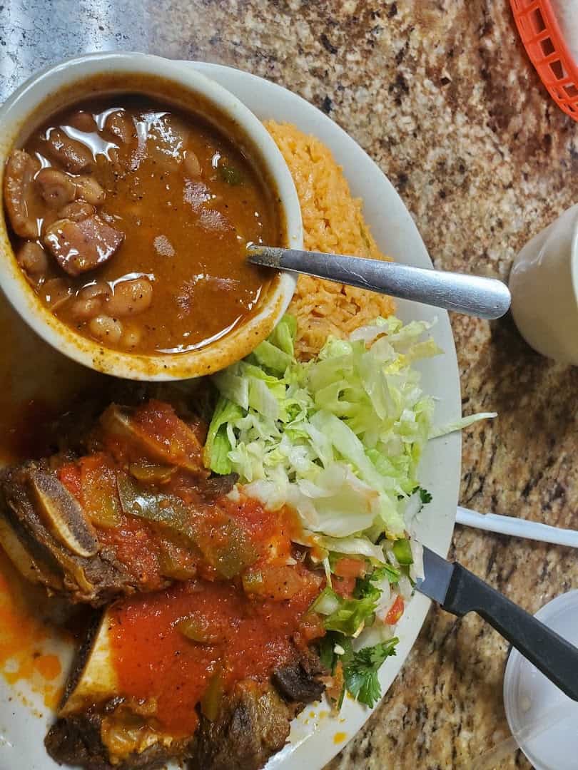 Beef in ranchera sauce with charro beans at Eddie's Taco House