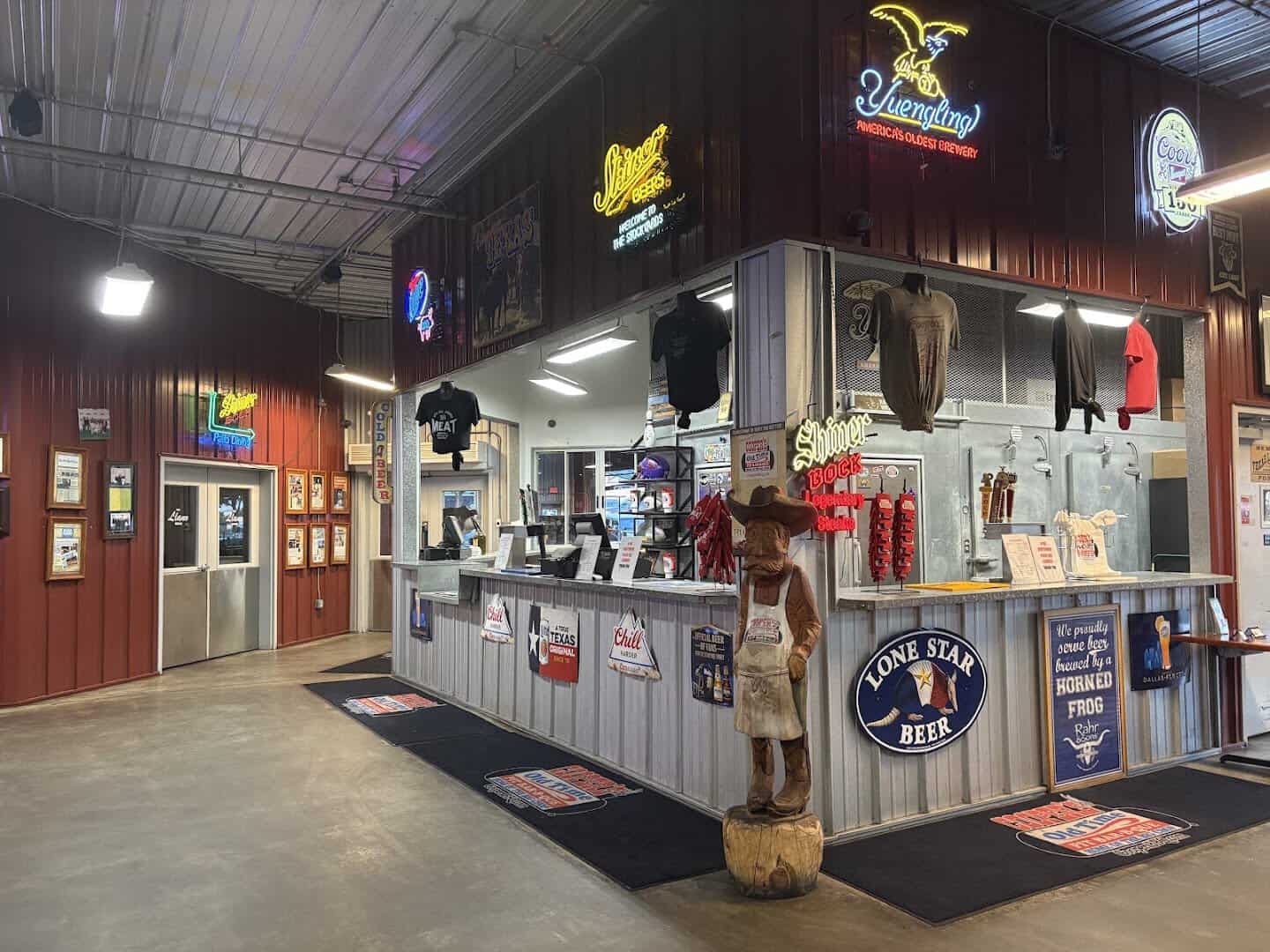 Drink and beer counter with neon signs at Cooper's in Fort Worth