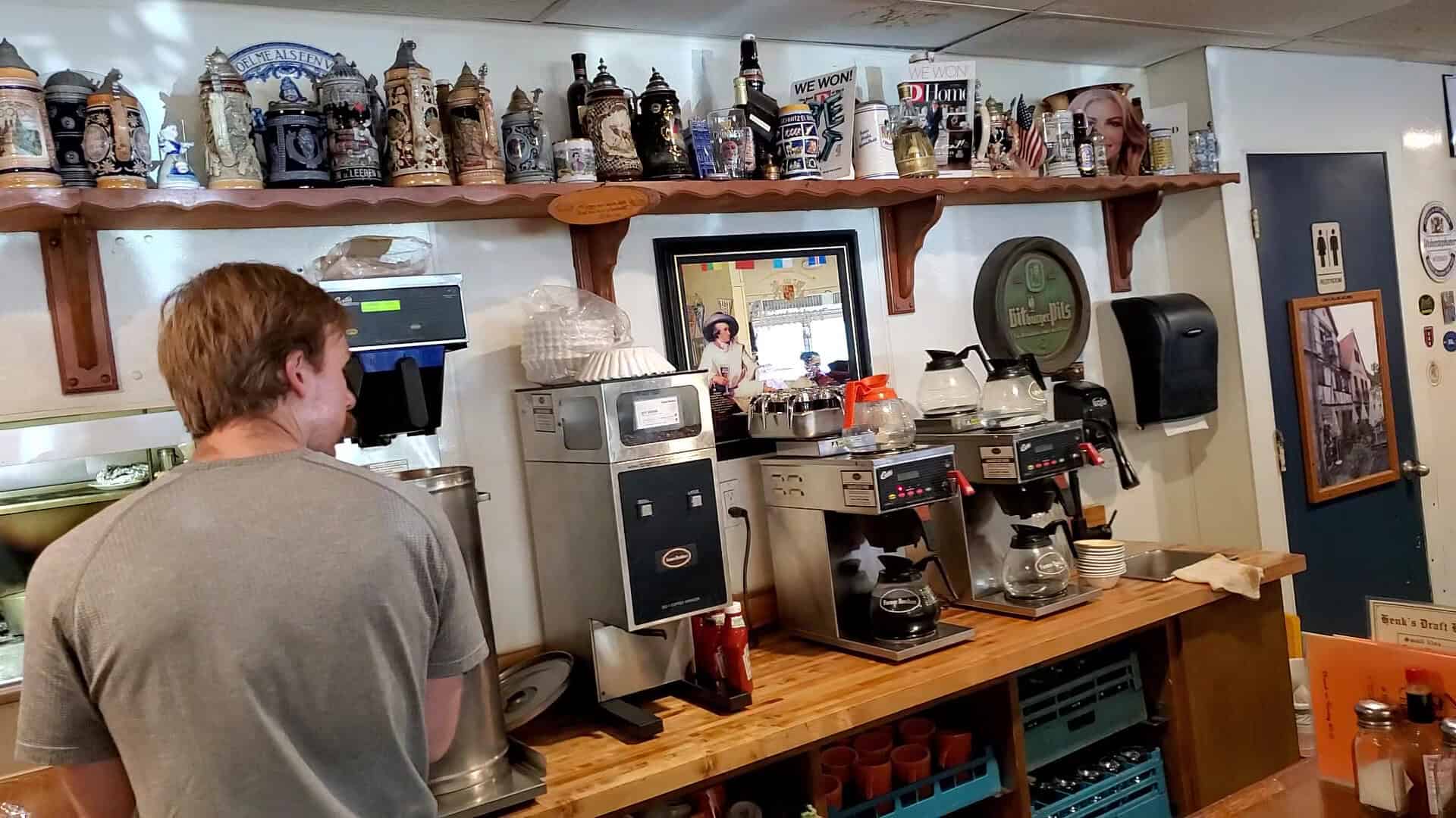 Bar lined with German beer steins at Henk's European Deli in Dallas