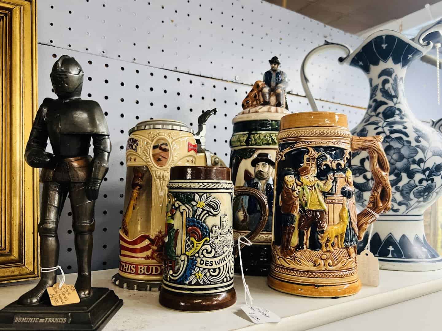 Display of German beer steins and a knight figure at Benbrook Antique Mall in Benbrook, Texas