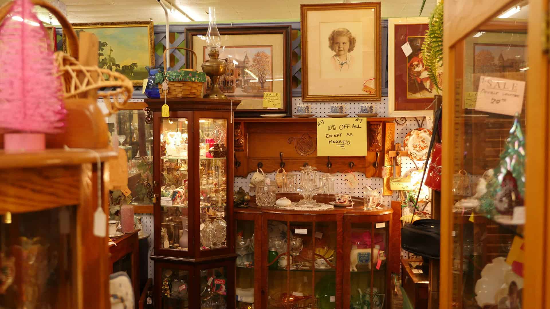Booth of vintage furniture and mirrors at Benbrook Antique Mall in Benbrook, Texas