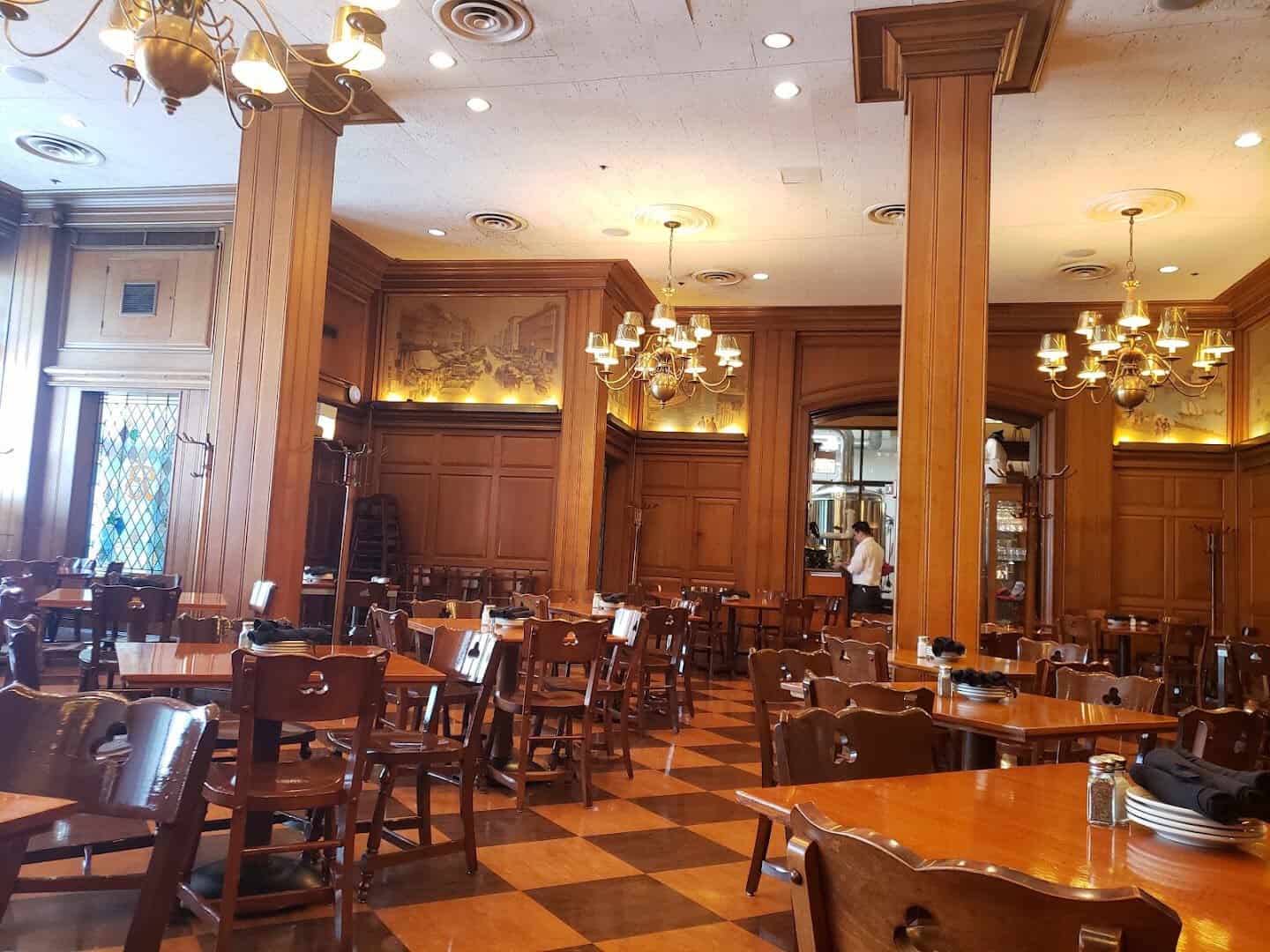 Historic carved-wood dining room at The Berghoff in Chicago, Illinois
