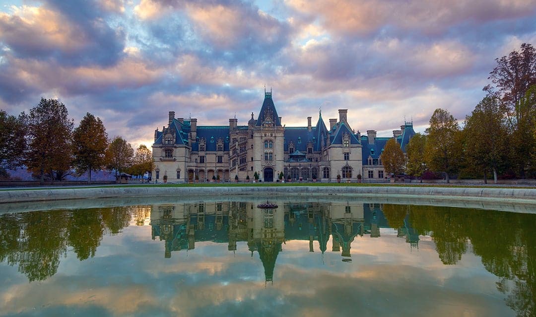 Biltmore Estate mansion reflected in its pool at sunset in Asheville, North Carolina