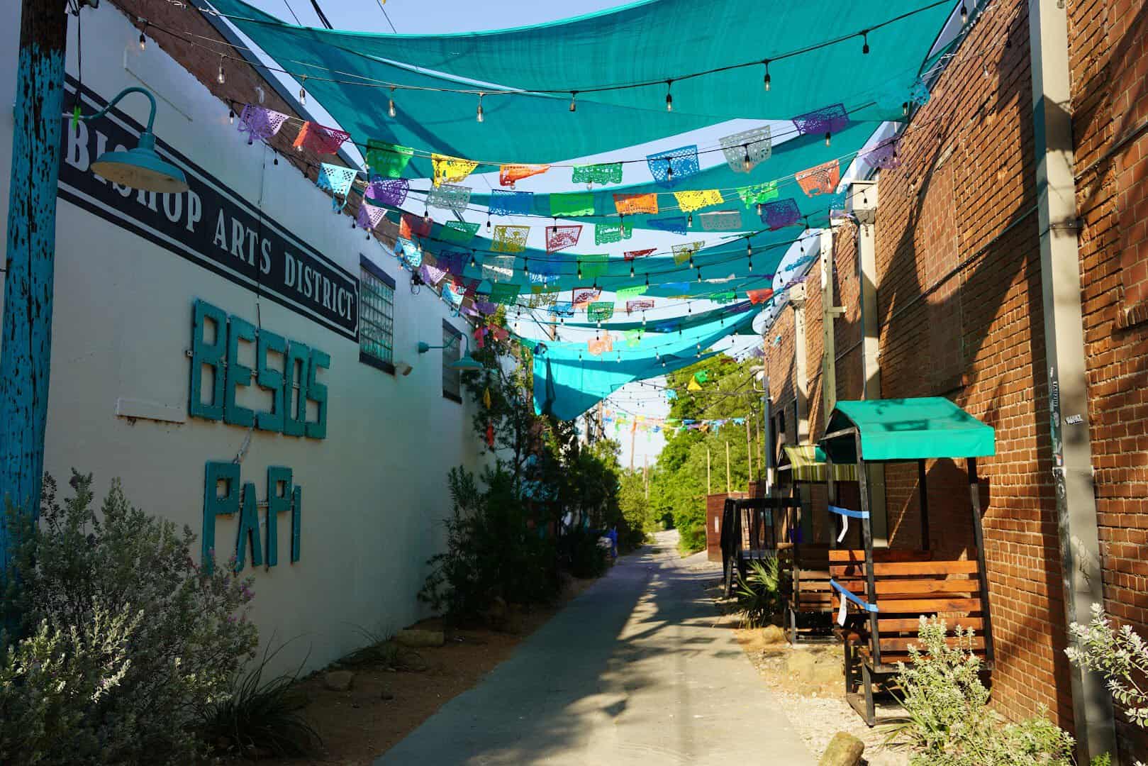 Papel picado banners strung over a walkway in the Bishop Arts District in Dallas, Texas