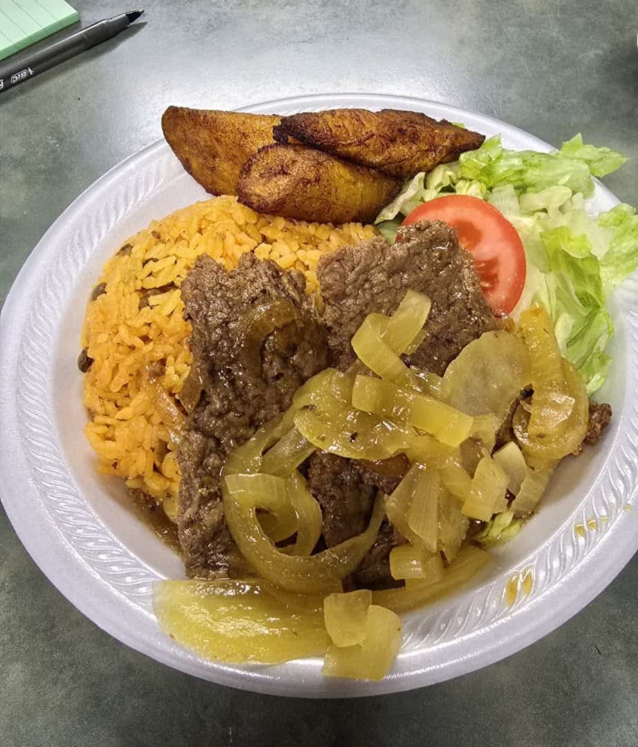 Bistec encebollado with rice and sweet plantains at El Flamboyan in Wylie, Texas